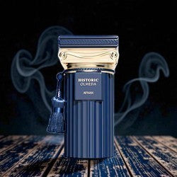 Newbelle Historic Olmeda Afnan unisex oriental woody fragrance in a fluted navy blue bottle with gold accents and tassel.
