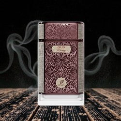 Newbelle Oud Rising unisex oriental woody fragrance in an ornate burgundy and textured bottle.
